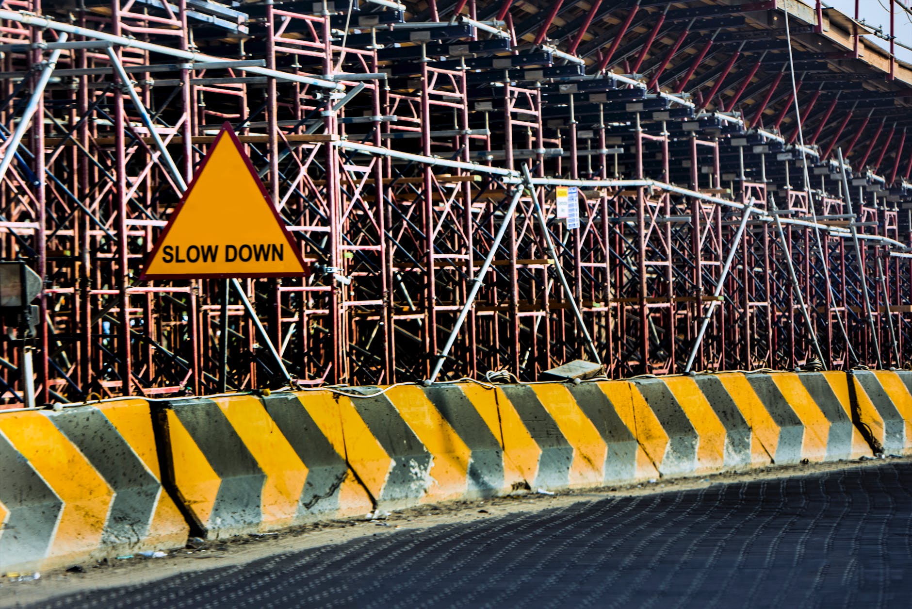 yellow and black road concrete barrier